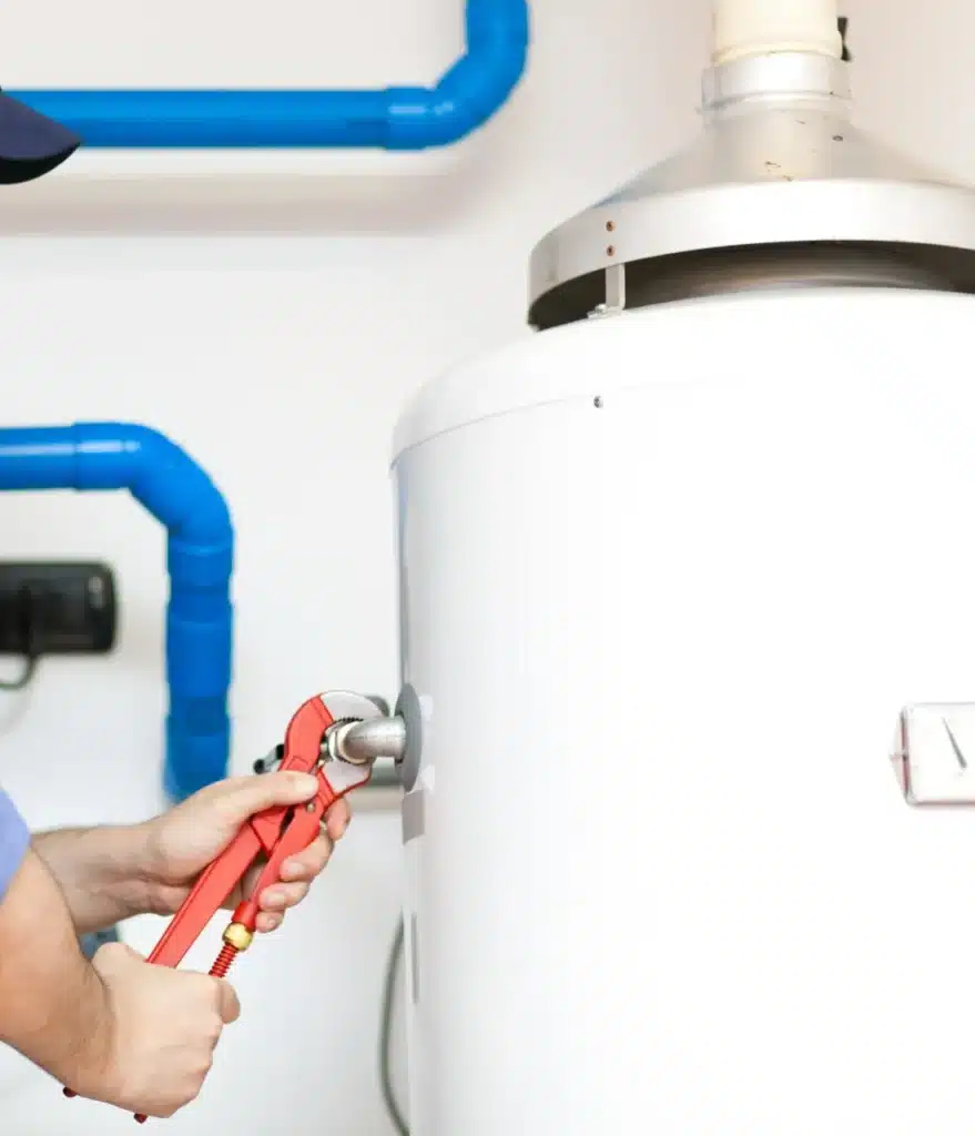 technician beginning to make repairs to a water heater