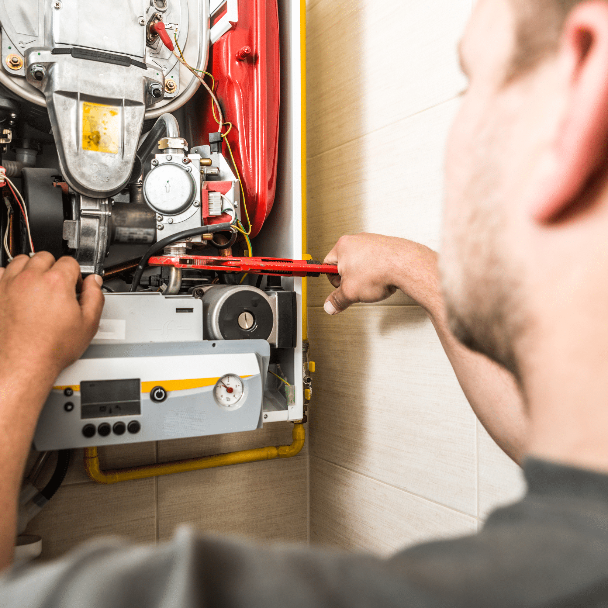  HVAC technician fixing a furnace issue  