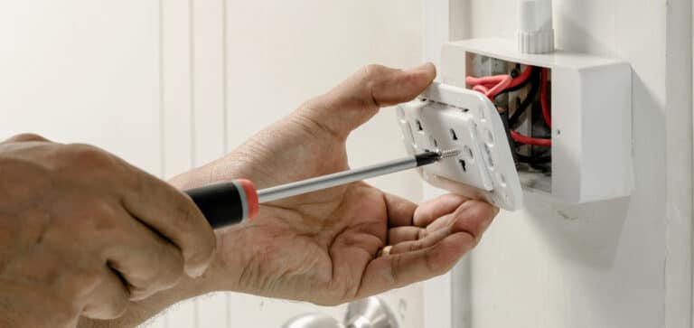  Electrician changing out an outlet 