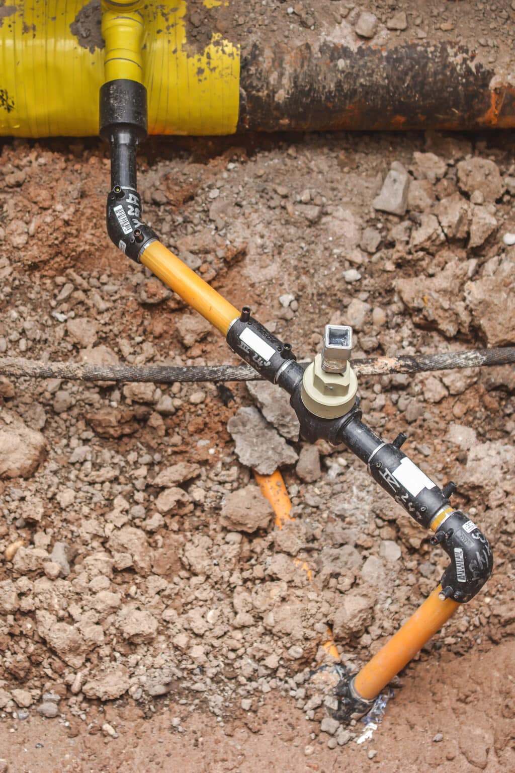 An underground gas pipe is unearthed for repairs