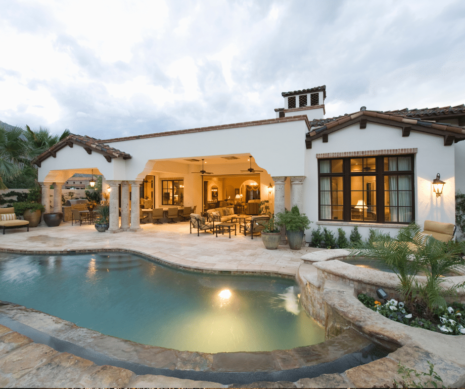 A home with a pool features outdoor lighting 