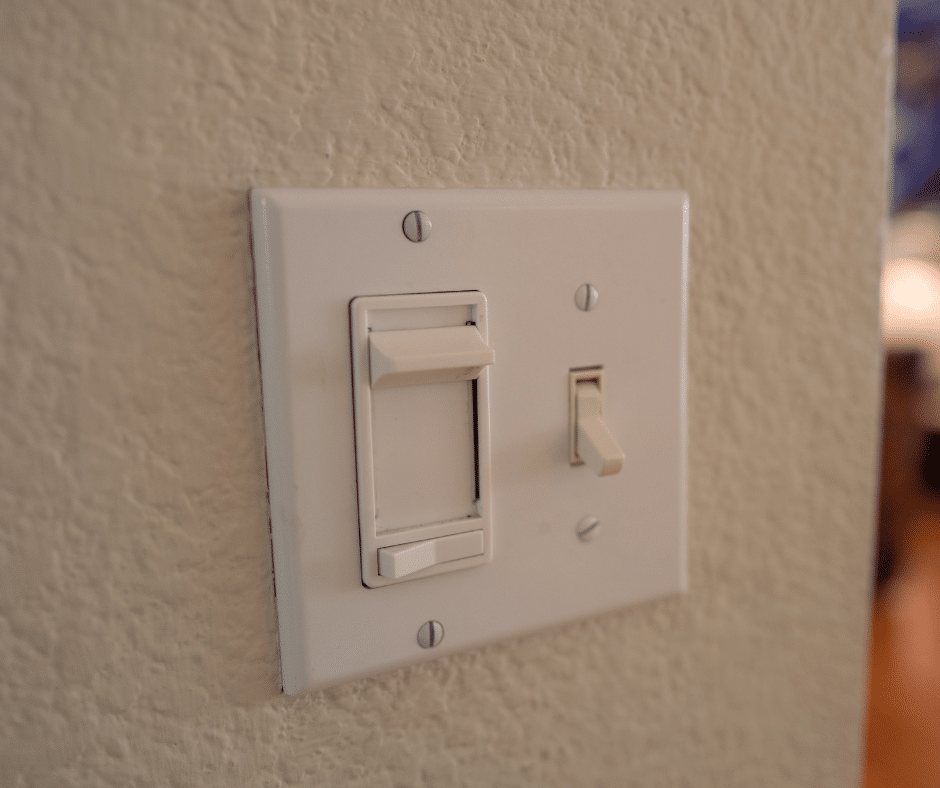 A light switch panel with a dimmer switch