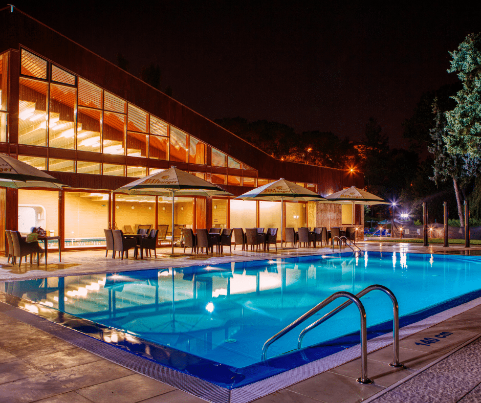 A pool is lit up at night